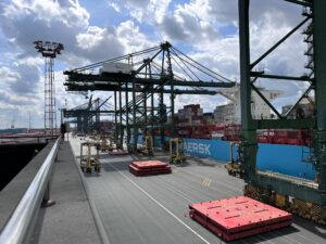 View of PSA cranes unloading containers from a Maersk vessel in the Port of Antwerp, Belgium