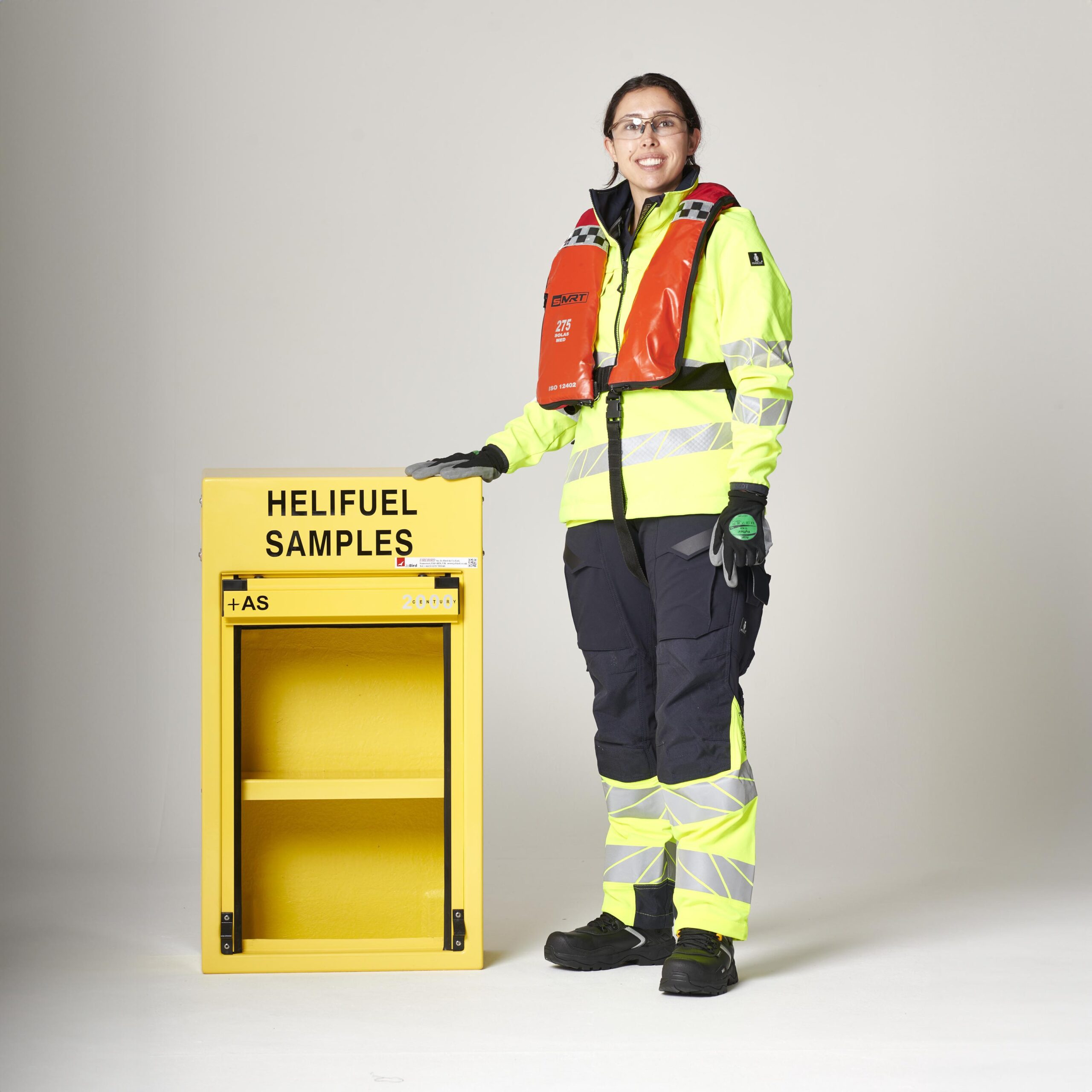 Heli-fuel sample jar cabinet by Jo Bird. The photo shows the compact size of this rugged cabinet with the roller door retracted into the cabinet roof. This reduces the risk of the person holding a jar, from being hit by a conventional door in windy conditions.
