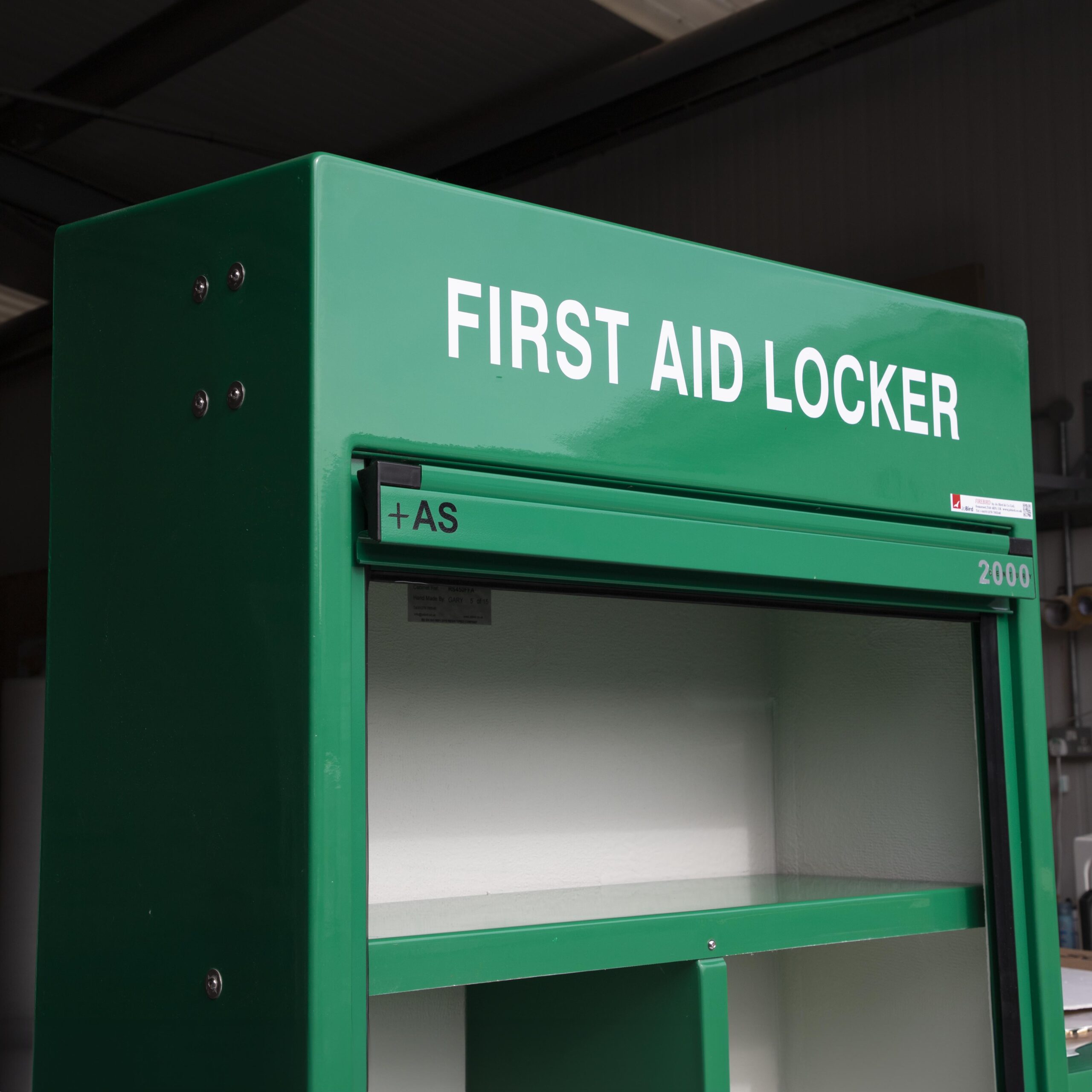 Close up of the top of the cabinet showing the roller door and top shelf