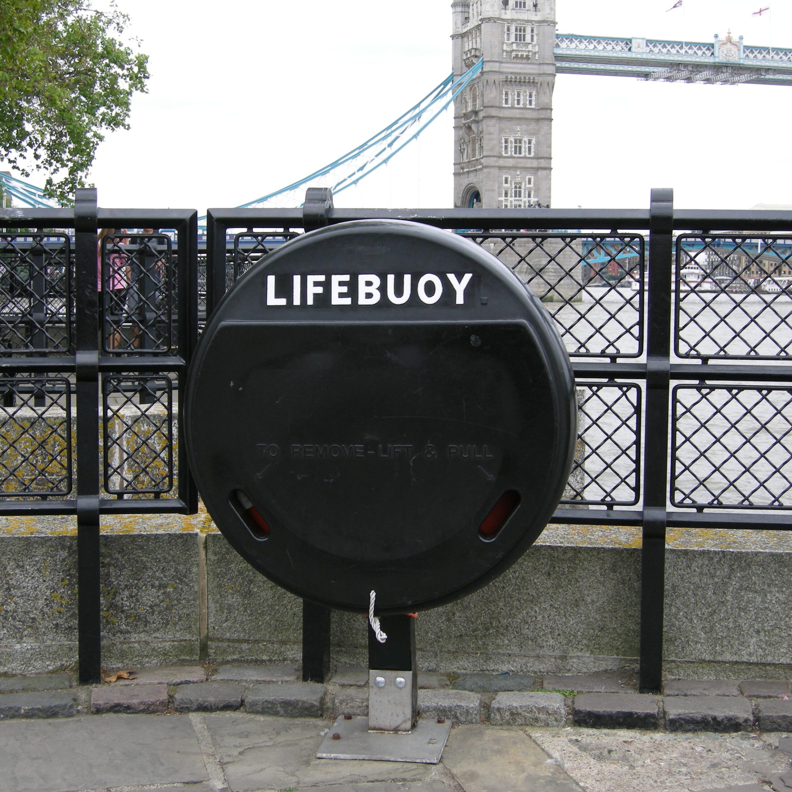Black lifebuoy housing by Jo Bird near Tower bridge. The SOS4 can be manufactured in a variety of colours.