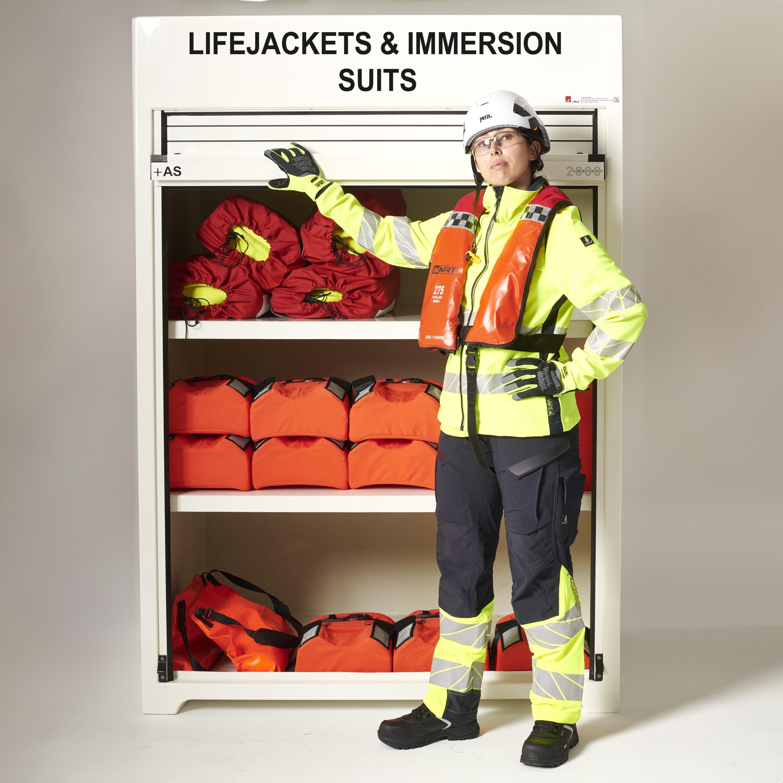 RS300.950 lifejacket and immersion suit cabinet in white. This one is fitted with two equally spaced shelves to provide separate storage area for the lifejackets and immersion suits. The roller door is in the open position with a figure stood next to it to give an idea of scale.